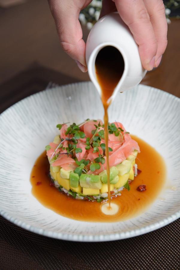 Royal Tulip Hotel & Casino, Tbilisi Exterior photo Soy sauce being drizzled over a sushi dish