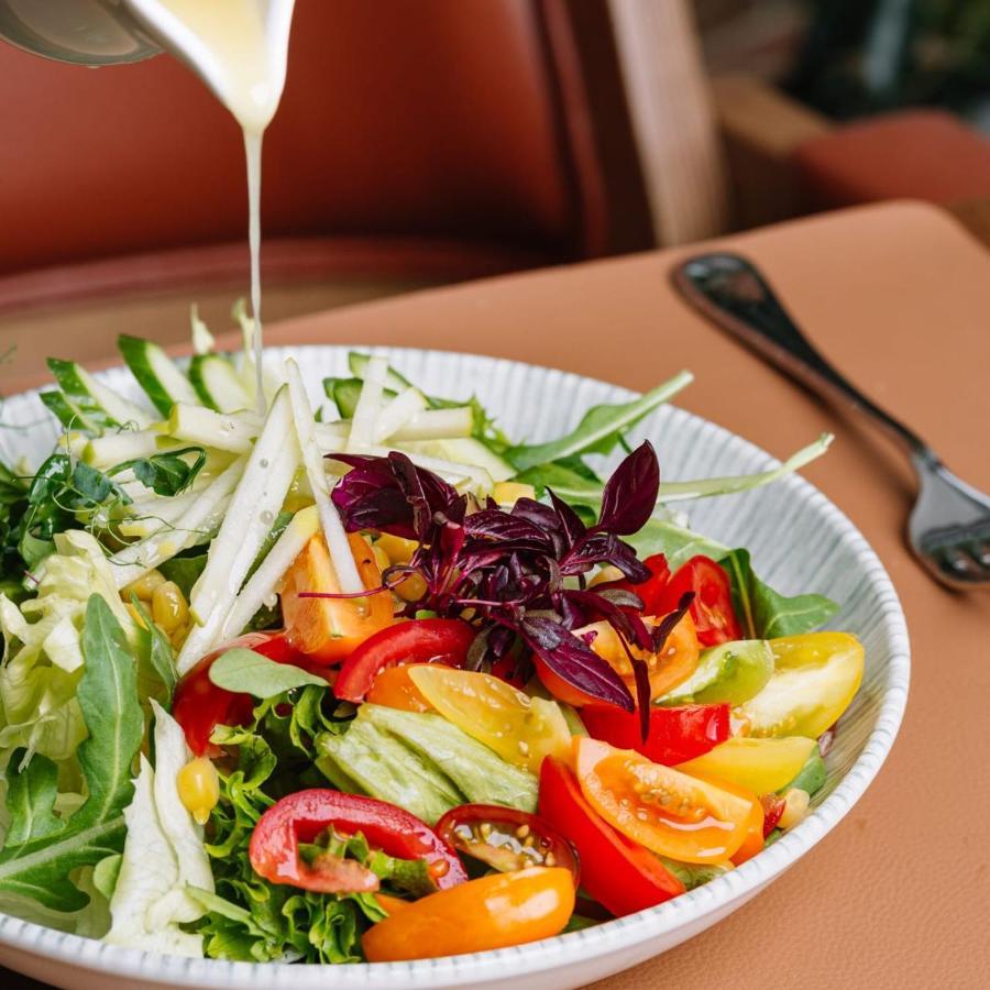 Royal Tulip Hotel & Casino, Tbilisi Exterior photo A salad being drizzled with a vinaigrette